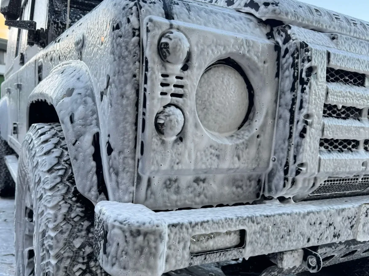 Pre-wash snow foam on Land Rover Defender.